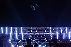 drone that is covered by drone insurance being used in a light show for a concert 
